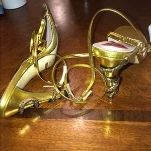 Gucci sandals gold w/snake heel.